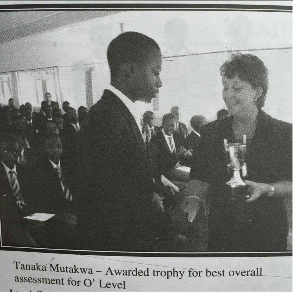 2005: Receiving an academic award at Kyle College, Zimbabwe. Put in the work!